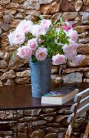 Rosa 'New Dawn' in pewter vase