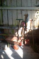 Children's tools in potting shed