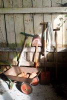 Childrens tools in potting shed