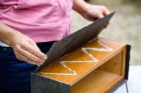 Making a slate planter. Gluing slate to the sides of a wooden box