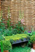 Thyme seat with willow hurdle fence boundary, Digitalis and chamomile - RHS Chelsea 2001
