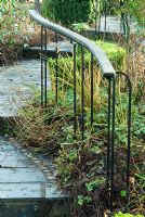 Hand rail beside slate steps in the West Country Town Garden, one of the model gardens - RHS Rosemoor