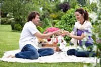 Couple enjoying a picnic in a garden