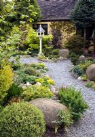 Gravel path leading to Dovecote with borders of rockery either side.  John Massey's Garden, Ashwood, West Midlands 