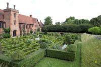 The Tudor Old Palace and Knot Garden at Hatfield House, where Elizabeth 1 spent much of her childhood. Garden contains Buxus - Box, and Crataegus - Hawthorn topiary.