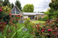 View of house from flowerbed - Breedenbroek, New Zealand