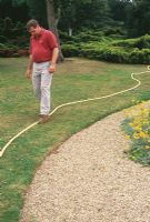 How to mark out your plot. A brightly coloured hosepipe is ideal for using as a guide to mark the boundary of a bed or border, or to mark the edges and route of a new path.