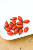 Tomato 'Tinkerbell' on white plate