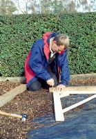 Making a pergola - Get pegs and string in place to form the outline then dig holes in the appropriate places, remember to measure to the centre of the hole