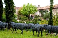 Flock of wire sheep by Sophie Ryder and Tarnaise garden, France.