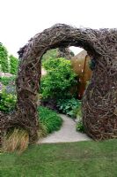 Salix archway in the John Joseph Mechi Garden, sponsored by Wilkin and Sons - Bronze medal winner at RHS Chelsea Flower Show 2010
