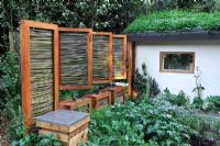 Motorised, woven willow windbreak panels. The SAC Strutt and Parker Sustainable Highland Garden, Silver Medal Winner, RHS Chelsea Flower Show 2010