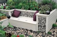 Cladded gabion sides and back on painted garden seat. RHS Chelsea Flower Show 2010 
 