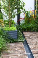 Water rill, stone paving and fruit trees and salad leaves in planters. 'Food 4 Thought' - Gold Medal Winner - RHS Hampton Court Flower Show 2010 
 