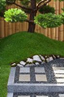 Gravel, stone patio and Pine tree. 'Konpira-san' - Gold Medal Winner - RHS Hampton Court Flower Show 2010
 