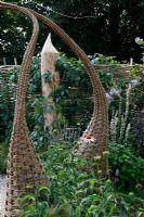 Willow structures in borders. 'It's Only Natural' - Silver Gilt Medal Winner - RHS Hampton Court Flower Show 2010 
 
