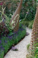 Willow structures and shell path in wildlife garden. 'It's Only Natural' - Silver Gilt Medal Winner - RHS Hampton Court Flower Show 2010 