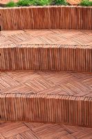 Herringbone terracotta tiled steps. 'The Garden Lounge' - Silver Gilt Medal Winner - RHS Hampton Court Flower Show 2010 