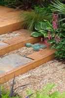 Gravel path and steps leading to oak deck. 'The Yoga Garden' - Bronze Medal Winner - RHS Hampton Court Flower Show 2010