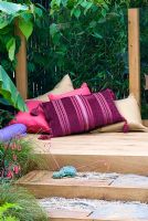 Cushions on oak decking. 'The Yoga Garden' - Bronze Medal Winner - RHS Hampton Court Flower Show 2010
 