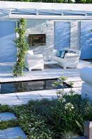 White themed borders and pond on patio with weatherproof furniture - 'The Living Room', Silver medal winner, RHS Hampton Court Flower Show 2010 
 