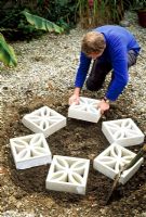 Herb Hexagon - Step 2. Lay six concrete screen wall blocks so as to form a hexagon in the centre