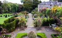 View from the upstairs window of the Garden Cottage of The Double border and the Walled Garden - Plas Cadnant, Menai Bridge, Anglesey, Wales