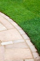 Curved flagstone path next to lawn in The Urban Retreat - RHS Hampton Court 2010 