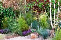 Gravel path with railway sleepers and Stipa tenuissima in The Fire Pit Garden - RHS Hampton Court 2010