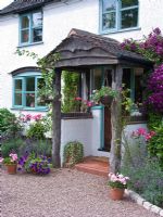 Front porch with hanging baskets and Clematis - Lilac Cottage, Staffordshire, NGS