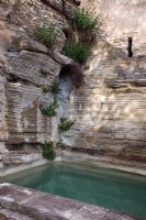 Swimming pool surrounded by rocks - La Louve Garden, Provence, France