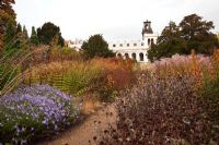 A gravel path leading through the new area of perennials and grasses, designed by Piet Oudolf - Trentham Gardens, Staffordshire, October