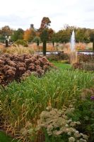 Overlooking the Italian Garden with grasses and seedheads of perennials designed by Tom Stuart-Smith at Trentham Gardens, Staffordshire, October
