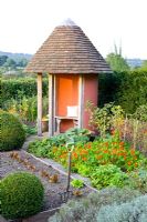 Potager with gazebo and view to countryside in late summer 
