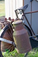 Old bicycle with milk churns 
