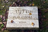 Inscription on stone slab. The Field. Il Bosco Della Ragnaia, San Giovanni D'Asso, Tuscany, Italy, October.  