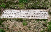 Inscription on slab in lawn. The Field. Il Bosco Della Ragnaia, San Giovanni D'Asso, Tuscany, Italy, October. 
 