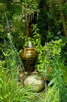 Urn water feature in small urban garden