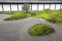 A karesansui garden, showing five moss covered sacred mountains placed on the sand garden-floor 'Hakkai', meaning the eight rough seas, designed by Mirei Shigemori in 1939 - Tofuku-ji, Kyoto, Japan 