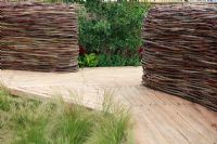 'NEST' woven from pliable willow and dogwood, made of feather grass, Stipa tenuissima - The Future Gardens, St Albans, Herts
