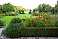 Heleniums in parterre, topiary and large lawns.