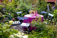 Dining area with blue and pink theme surrounded by colourful borders