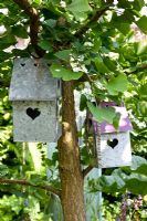 Metal decorative bird houses with heart motif