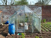 Greenhouse on allotment in early spring