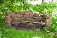 Bench made from stone blocks. Ryton Organic Garden