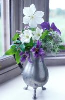 Clematis in flower arrangement
