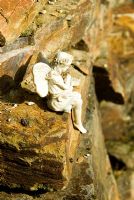 Fairy figurine on granite wall - Pinsla Garden, Cardinham, Cornwall