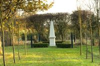 Avenue of aok trees and stone obelisk - Silverstone Farm, Norfolk