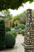 Pebble obelisk, topiary and water feature - Silverstone Farm, Norfolk