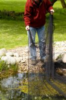 Covering netting over a pond